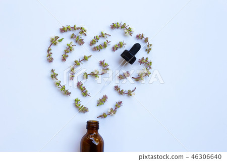Flower of sweet basil with drop bottle Flower of sweet basil with drop bottle 46306640