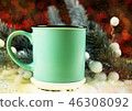 Christmas mug over bokeh background. 46308092