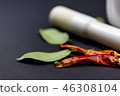 Mortar with chilli pepper. 46308104