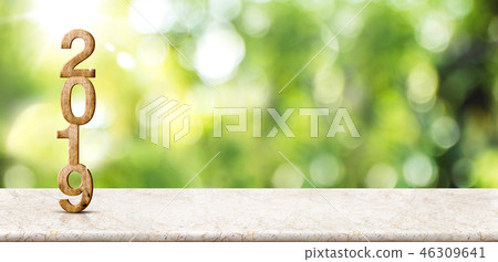 New year 2019 on marble table at blur tree New year 2019 on marble table at blur tree 46309641