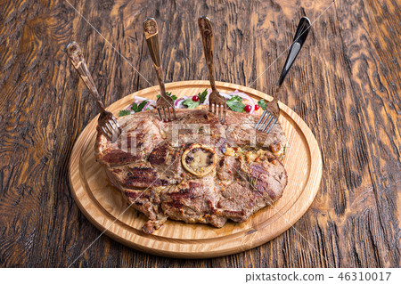 ribeye steak on a board ribeye steak on a board 46310017