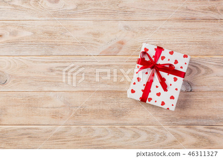 holiday handmade present in paper with red heart holiday handmade present in paper with red heart 46311327