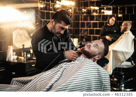 Clients in barbershop 46312385