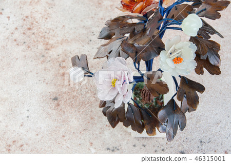 Vintage glass flowers on concrete background. 46315001