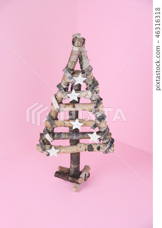 Christmas wooden tree over light blue background. Christmas wooden tree over light blue background. 46316318
