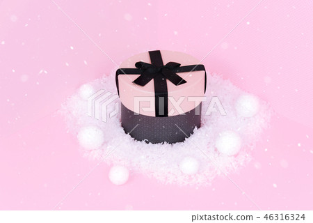Gift box with ribbon on an pink background. Gift box with ribbon on an pink background. 46316324