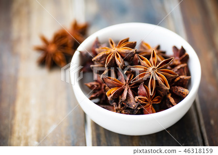 Star anise in a bowl on wooden, herbs and spices Star anise in a bowl on wooden, herbs and spices 46318159