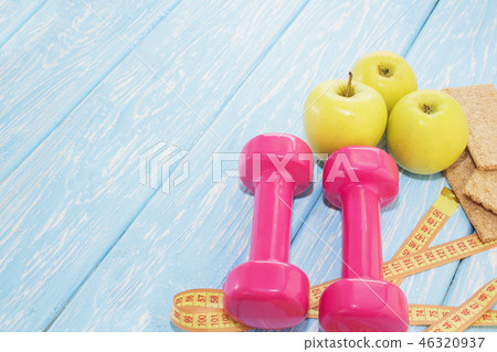 The concept of a healthy diet. Small dumbbells.  46320937
