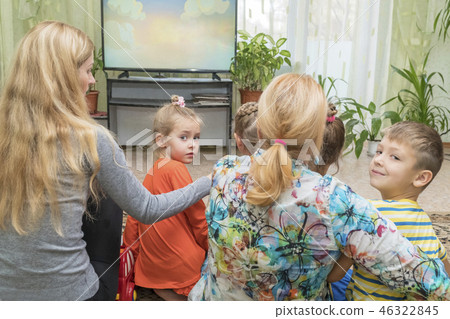 Grandmother with children at the TV Grandmother with children at the TV 46322845