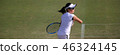 Junior tennis player hitting forehand stroke on a natural turf court 46324145