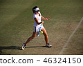 Junior tennis player hitting forehand stroke on a natural turf court 46324150