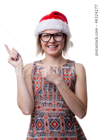 Image of blonde in glasses and santa cap showing finger on empty space Image of blonde in glasses and santa cap showing finger on empty space 46324277