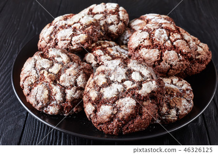 Chocolate Crinkle cookies on a platter, close-up 46326125