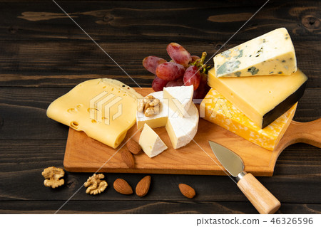 Various types of cheese on a rustic table Various types of cheese on a rustic table 46326596