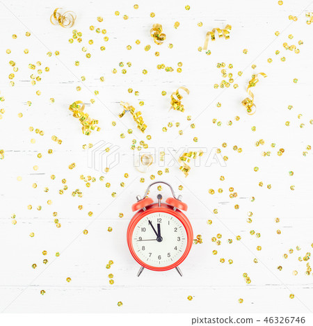 New Year composition alarm clock golden confetti New Year composition alarm clock golden confetti 46326746