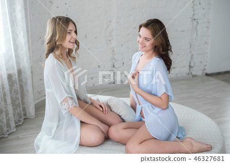 Two sexy girls girlfriends in the bedroom Two sexy girls girlfriends in the bedroom 46327681