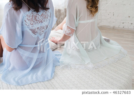 Girlfriend in lingerie in transparent negligees. Girlfriend in lingerie in transparent negligees. 46327683
