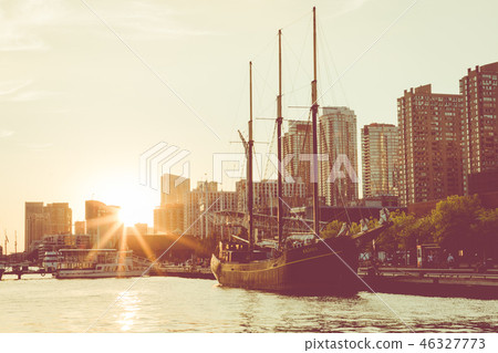 Sunset at the Ontario lake with tall ship standing Sunset at the Ontario lake with tall ship standing 46327773