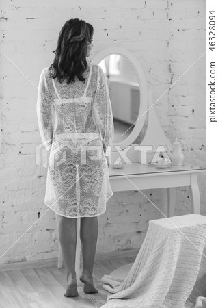 gentle young woman in the morning light in the bedroom gentle young woman in the morning light in the bedroom 46328094