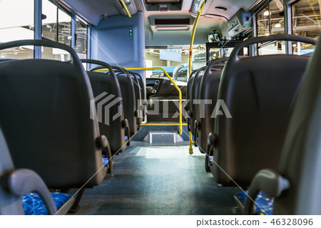City vehicle bus salon with empty passengers seats City vehicle bus salon with empty passengers seats 46328096