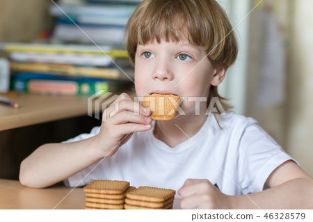 child eating cookies child eating cookies 46328579