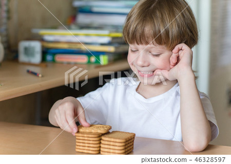 child eating cookies child eating cookies 46328597