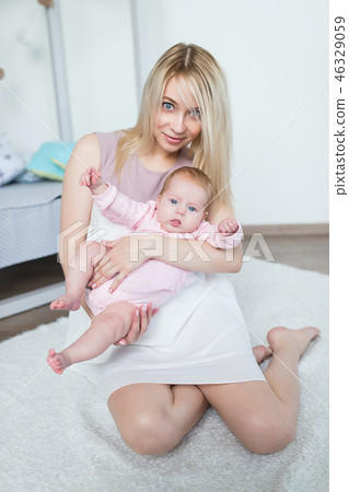 mother playing with her baby mother playing with her baby 46329059