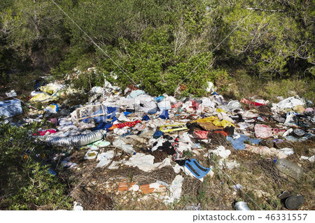open dump by a rural lane open dump by a rural lane 46331557