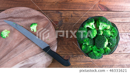 Broccoli and wood chopping. Broccoli and wood chopping. 46331621
