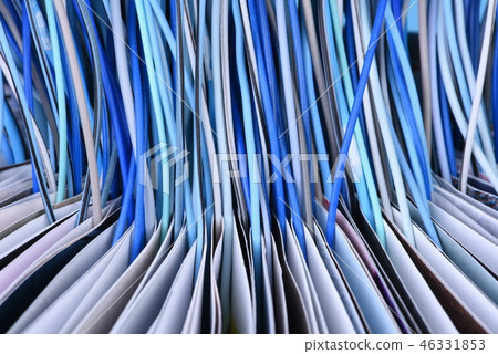 Opened book with computer network cables close-up 46331853