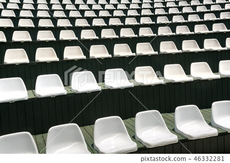 Rows of empty white chairs in the summer hall 46332281