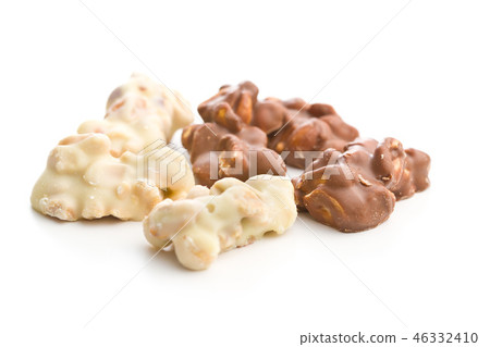 Peanuts covered white and dark chocolate. Peanuts covered white and dark chocolate. 46332410