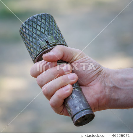 Antitank grenade in the male hand close-up 46336071