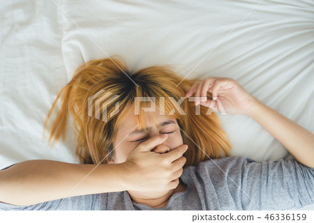Asian woman sleeping in bed in the morning.  46336159
