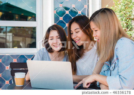 women working together on laptop in cafe. women working together on laptop in cafe. 46336178