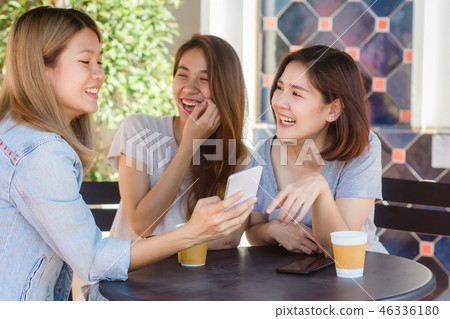 women sitting in cafe drinking coffee with friends women sitting in cafe drinking coffee with friends 46336180