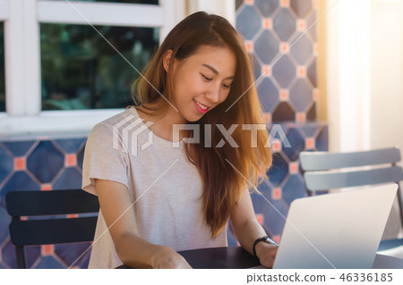 woman working on laptop in cafe. woman working on laptop in cafe. 46336185