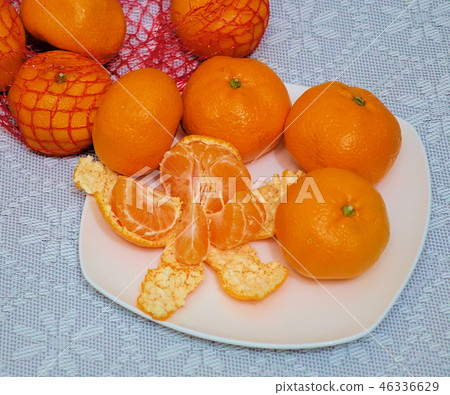 peeled mandarin divided into slices peeled mandarin divided into slices 46336629