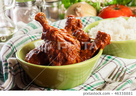 Chicken drumsticks curry with rice 46338881
