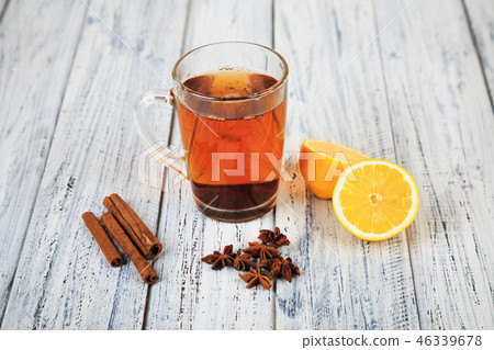 hot tea, cinnamon sticks, star anise and orange hot tea, cinnamon sticks, star anise and orange 46339678