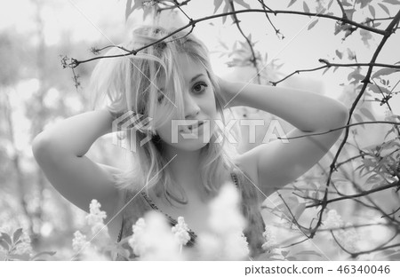 Black And White Photo Of Young Woman In A Garden 46340046