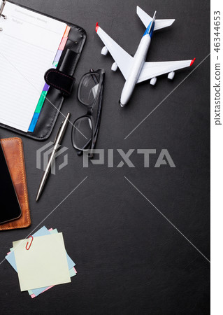 Business trip concept. Accessories on desk table 46344653