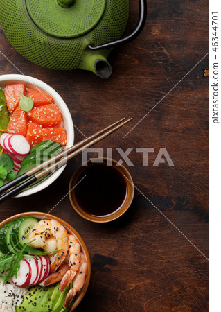 Poke bowl with salmon and vegetables Poke bowl with salmon and vegetables 46344701