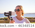 video blogger making video with gimbal 46348514