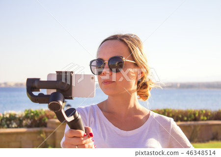 video blogger making video with gimbal video blogger making video with gimbal 46348514