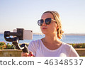 video blogger making video with gimbal 46348537