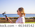 video blogger making video with gimbal 46348542