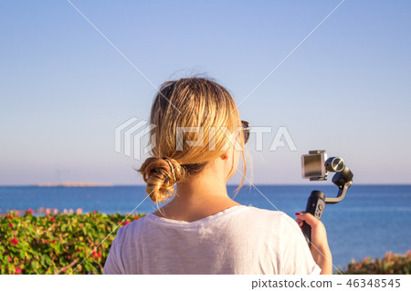 video blogger making video with gimbal video blogger making video with gimbal 46348545