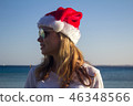 woman in Santa Claus hat.  46348566