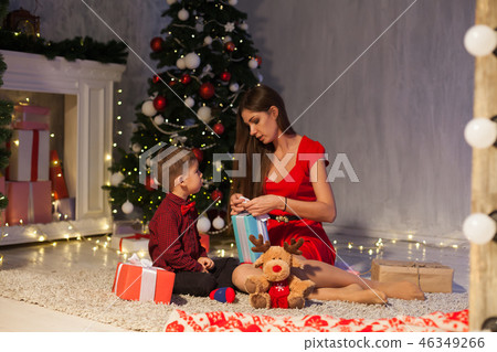 mother and son celebrate the new year Christmas tree gifts mother and son celebrate the new year Christmas tree gifts 46349266